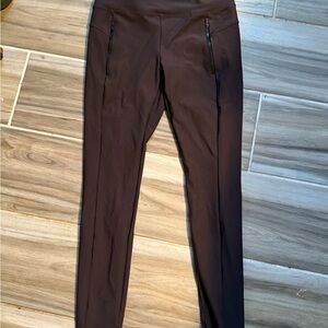Dark purple Athleta  Leggings with Zipper Pockets.